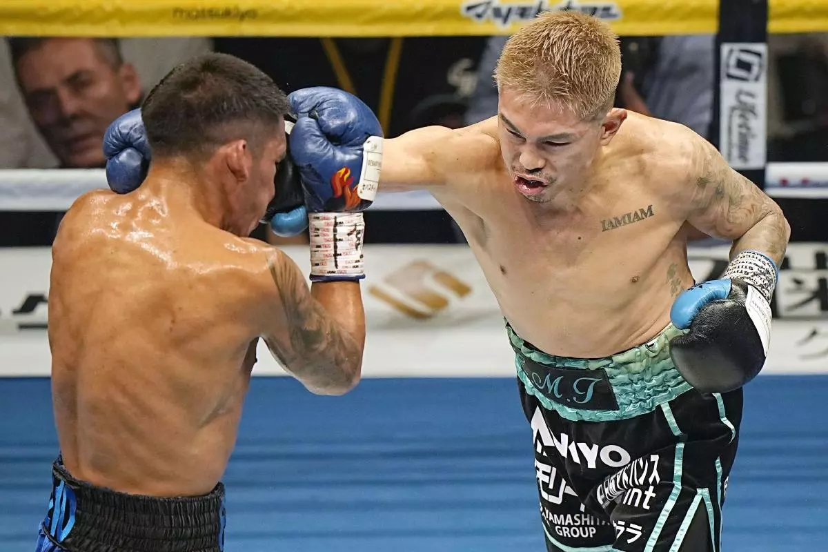 Japan's Kazuto Ioka (R) throws a punch at Joshua Franco of the United States - June 2023