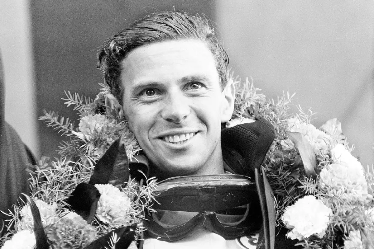 Jim Clark, British Formula One racing driver for Lotus-Climax, pictured celebrating after winning British Grand Prix at Brands Hatch