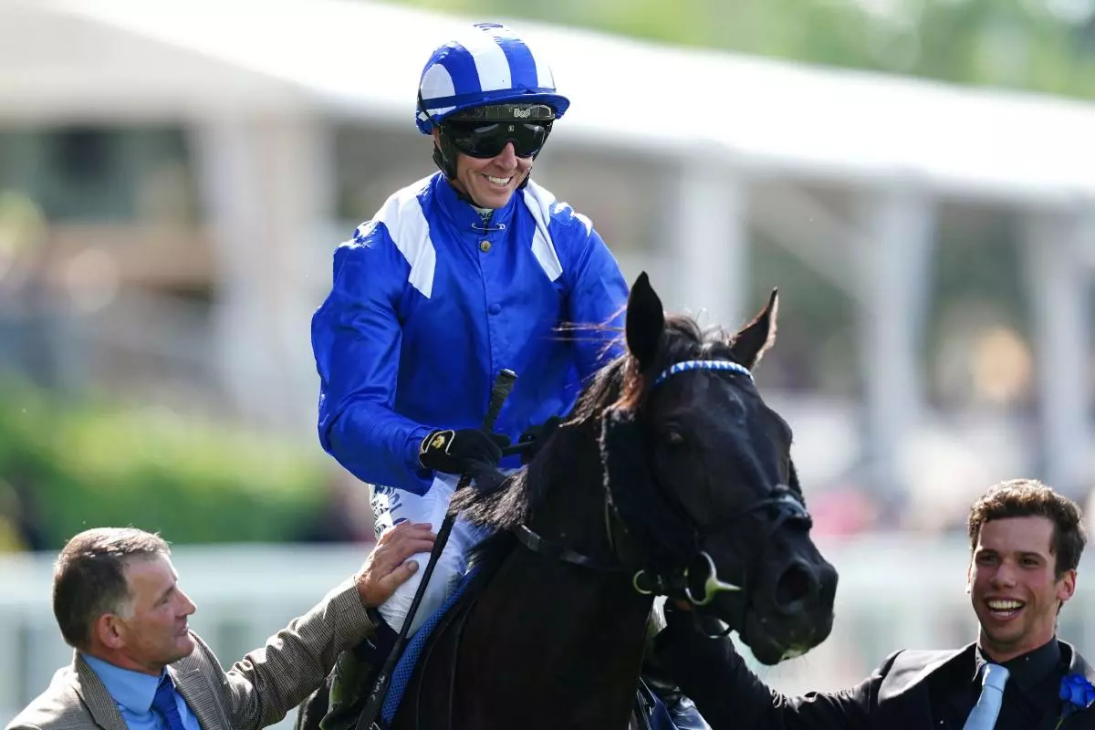 Jim Crowley smiles on board Mostahdaf after winning the Prince Of Wales's Stakes