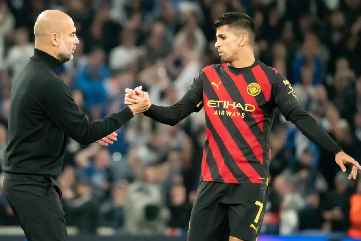 Joao Cancelo and Pep Guardiola
