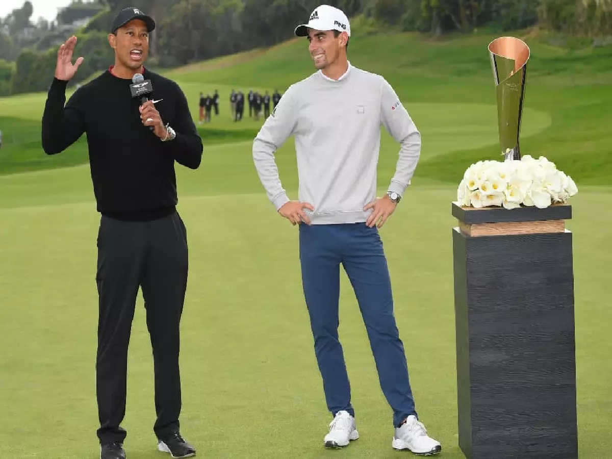 Joaquin Niemann receives The Genesis Invitational trophy from Tiger Woods