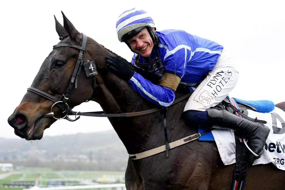 Jockey Paul Townend celebrates after winning the Betway Queen Mother Champion Chase aboard Energumene