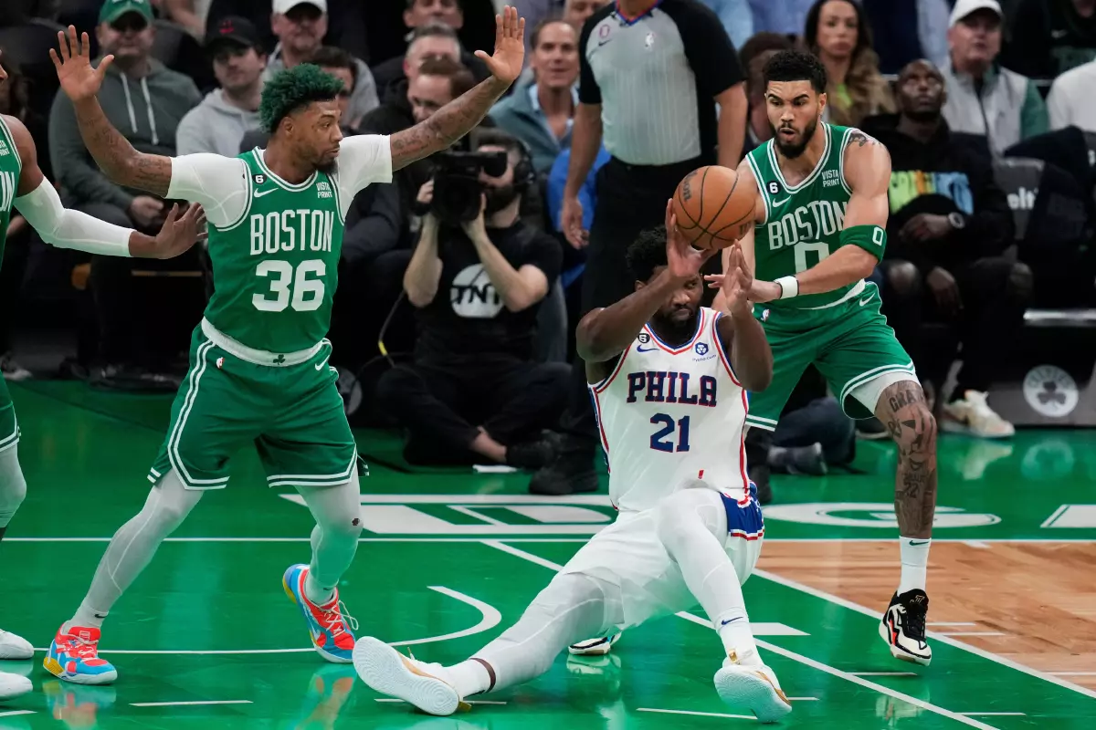 Joel Embiid pressured by Boston Celtics Jayson Tatum and Marcus Smart 3rd May 2023