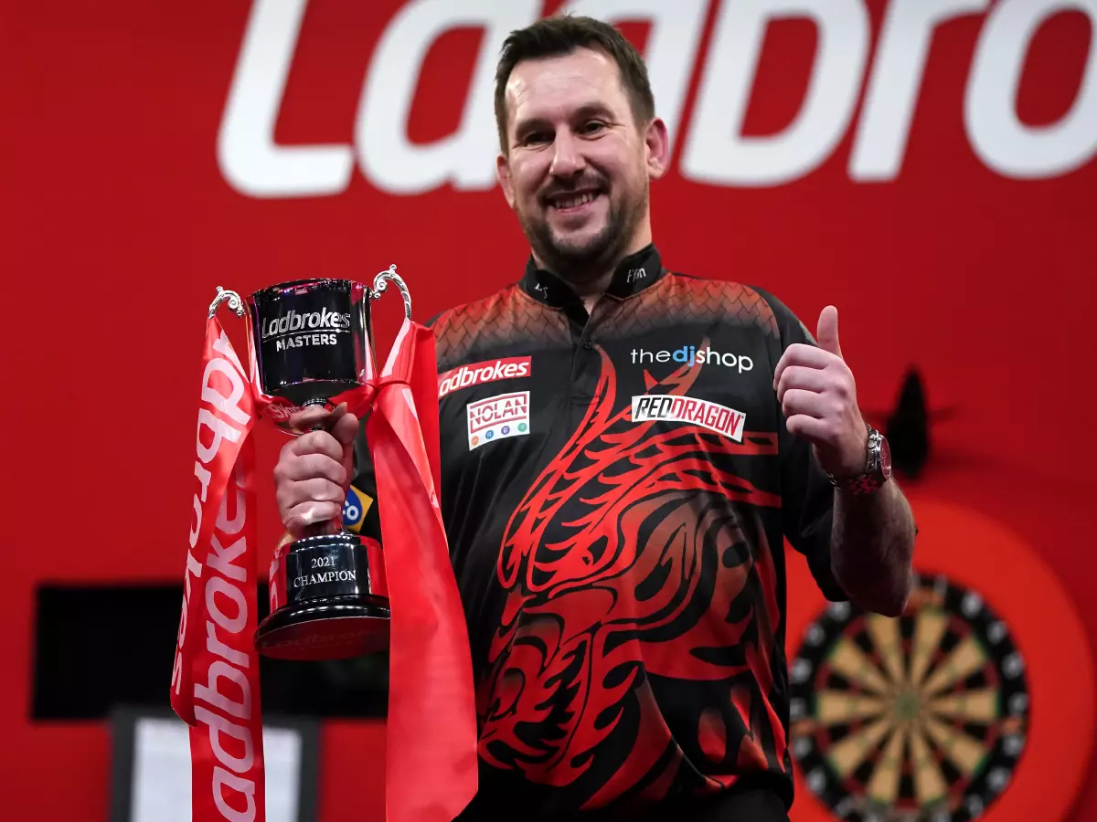 Jonny Clayton lifts the trophy after winning the Ladbrokes Masters 2021 tournament at the Marshall Arena, Milton Keynes. Picture date: Sunday January 31, 2021.