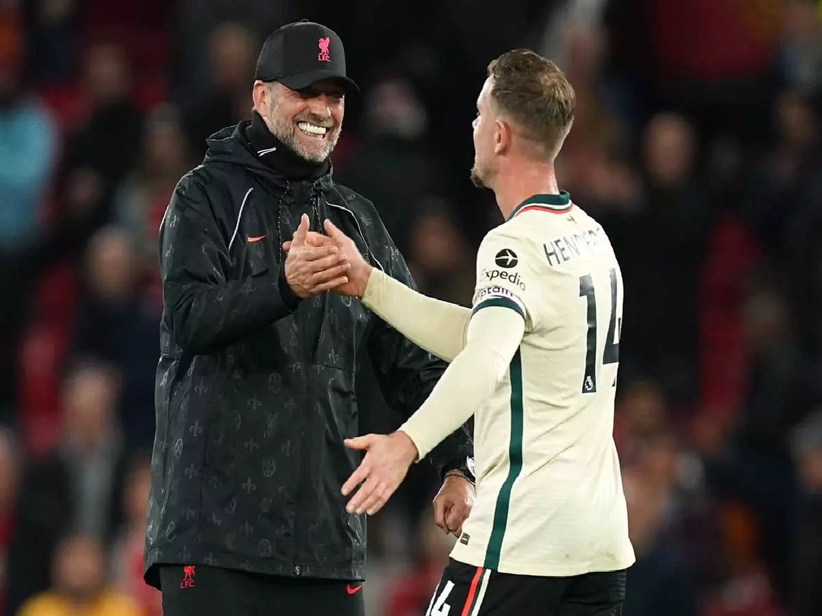 Jordan Henderson congratulated by Jurgen Klopp