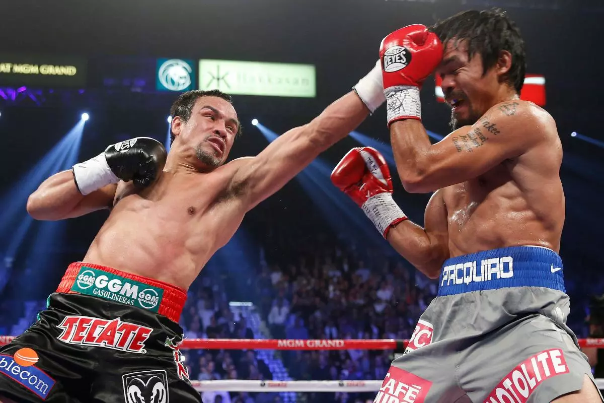 Juan Manuel Marquez lands a left against Manny Pacquiao