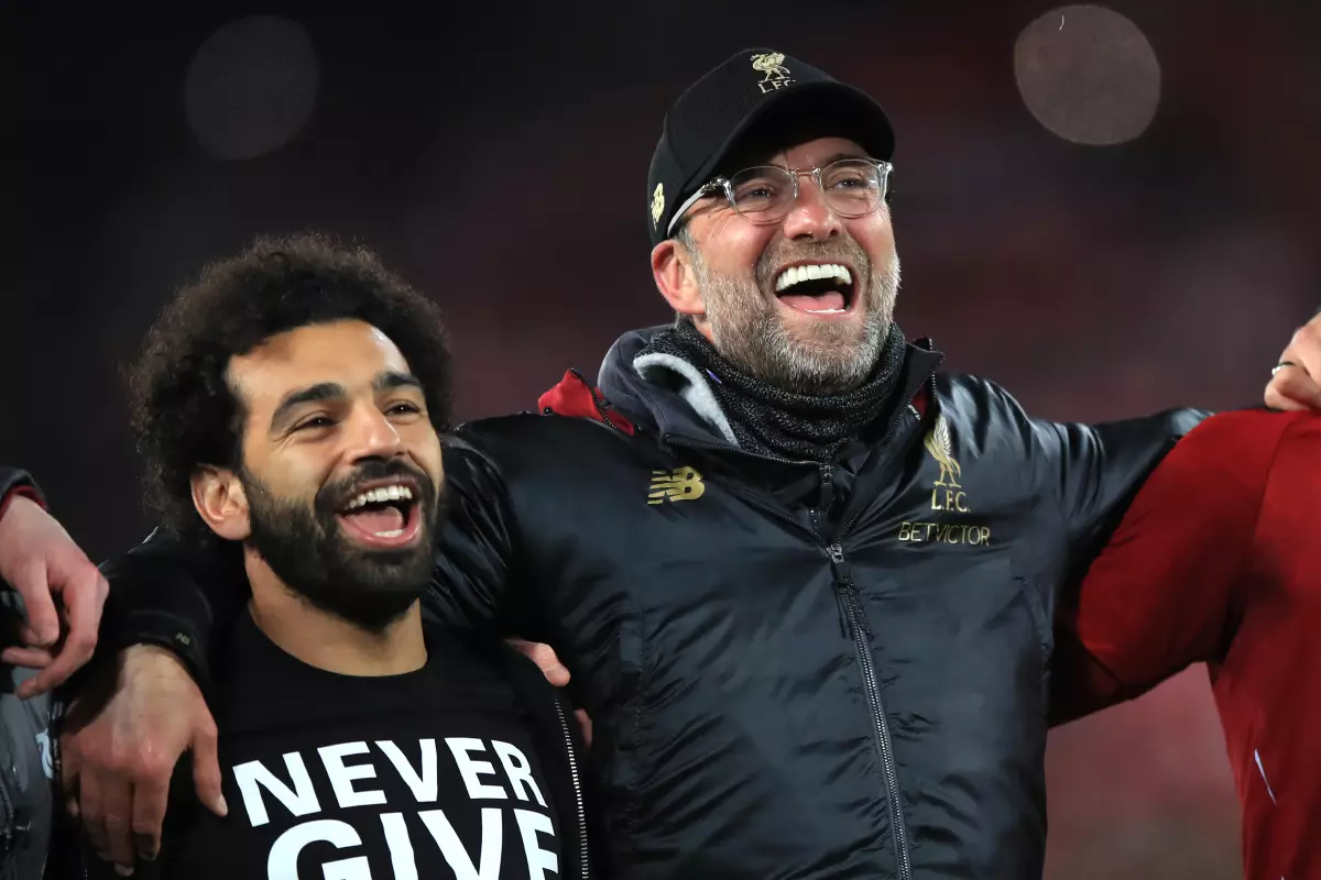 Liverpool's Mohamed Salah (left) and manager Jurgen Klopp celebrate after the UEFA Champions League Semi Final, second leg match at Anfield, Liverpool.