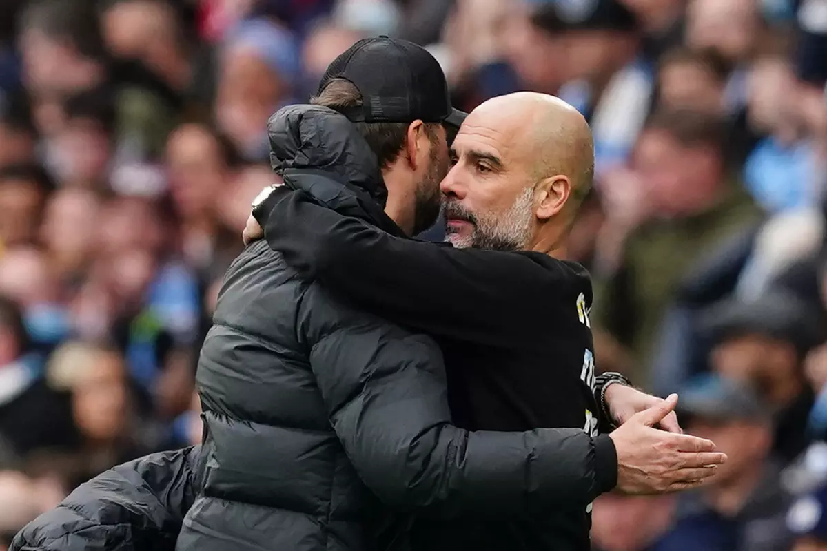 Jurgen Klopp and Pep Guardiola share a hug after Manchester City vs Liverpool