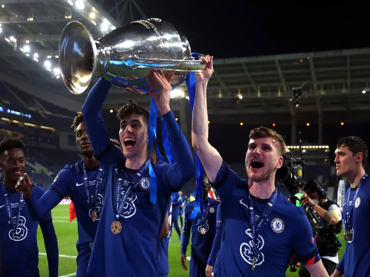 Chelsea's Kai Havertz (left) lifts the trophy with Timo Werner following victory in the UEFA Champions League final match held at Estadio do Dragao in Porto