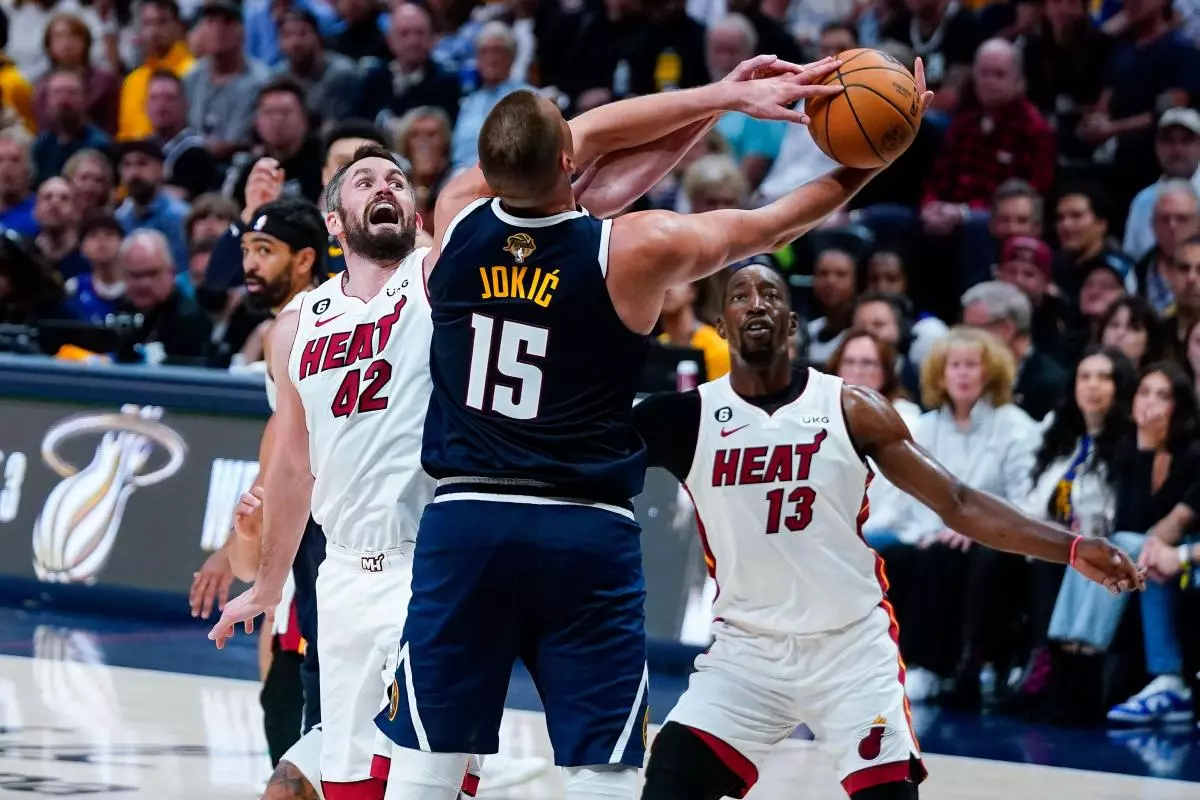 Kevin Love and Bam Adebayo challenge Nikola Jokic in the NBA Finals June 4, 2023