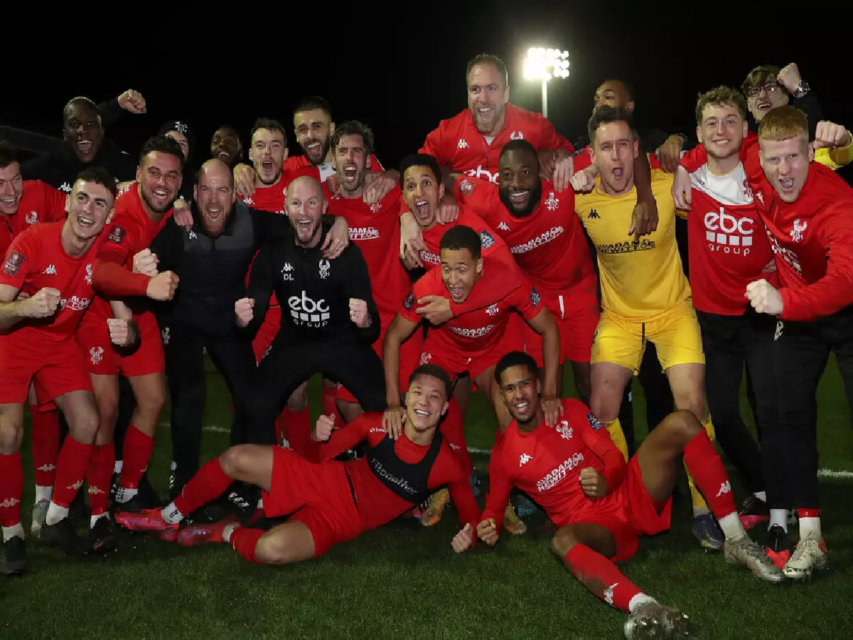 Kidderminster players celebrate after knocking Reading out the FA Cup