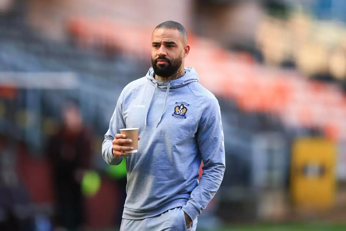 Kyle Vassell of Kilmarnock inspects the pitch before the match Feb 2023