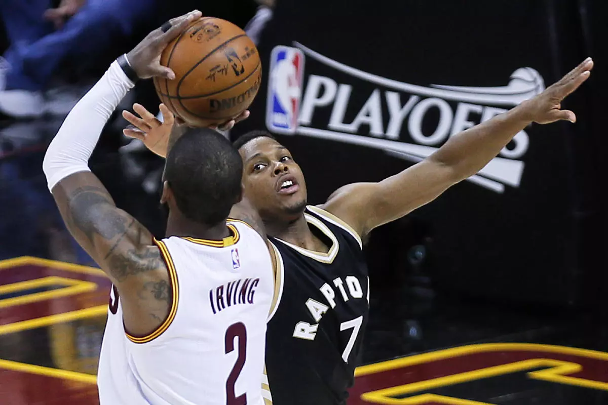 Kyrie Irving shoots a 3-pointer over the Toronto Raptors' Kyle Lowry.jpg