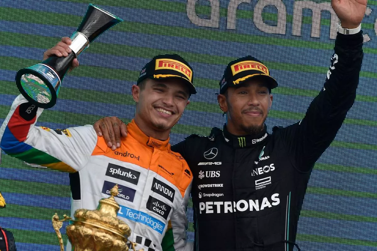 Lando Norris and Sir Lewis Hamilton celebrate after the British Grand Prix - July 2023