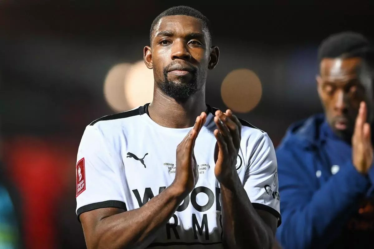 Lee Ndlovu #9 of Boreham Wood applauds the fans