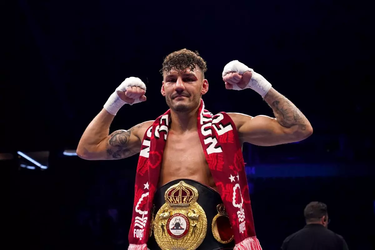 Leigh Wood celebrates after winning the WBA World Featherweight title at the AO Arena - May 2023