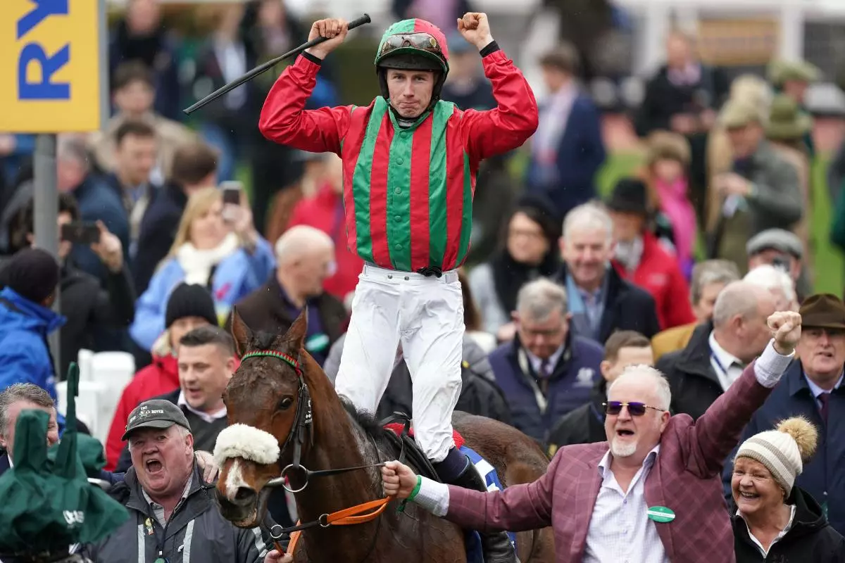 Liam McKenna celebrates after winning the Pertemps Network Final Handicap Hurdle aboard Good Time Jonny