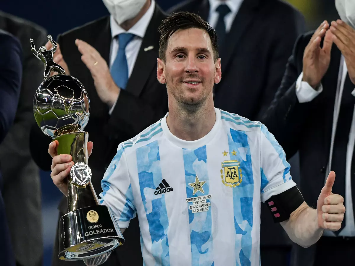 Lionel Messi player from Argentina lifts the champion's cup during an award ceremony at the end of the match against Brazil at the Maracana stadium for the decision of the Copa America 2021