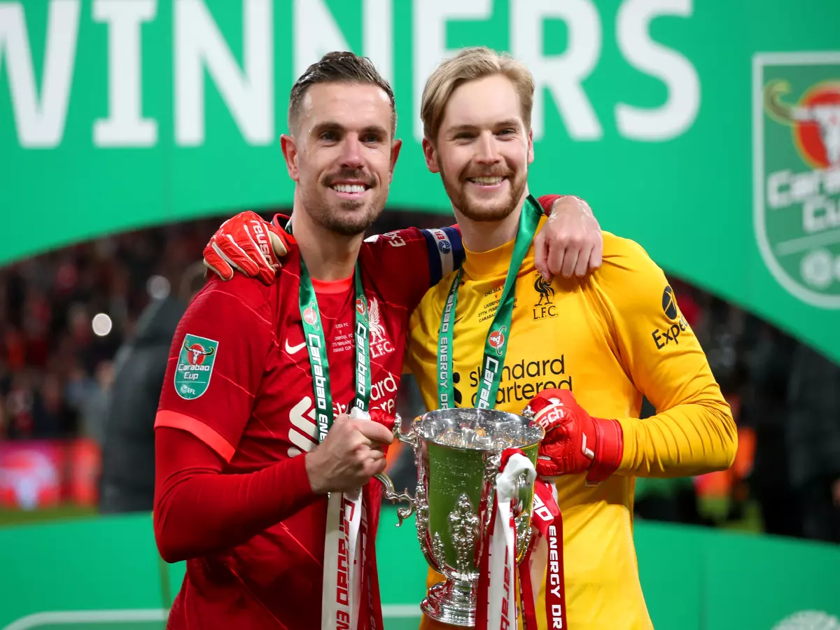 Liverpool's Jordan Henderson (left) and goalkeeper Caoimhin Kelleher celebrate with the trophy after winning the Carabao Cup final at Wembley Stadium, London. Picture date: Sunday 27th Februa