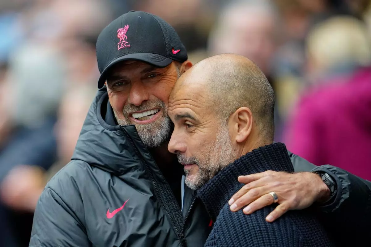 Liverpool's manager Jurgen Klopp, left, greets Manchester City's head coach Pep Guardiola