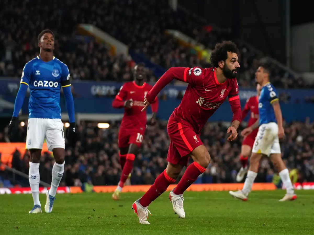 Mohamed Salah celebrates scoring for Liverpool in the Merseyside derby