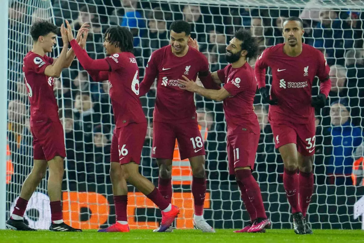 Liverpool's Cody Gakpo, centre, celebrates after scoring his side's second goal