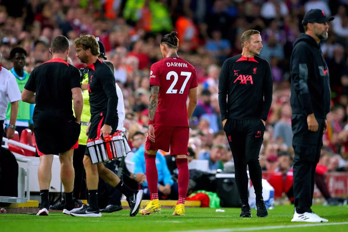 Liverpool's Darwin Nunez (centre) leaves the pitch after receiving a red card