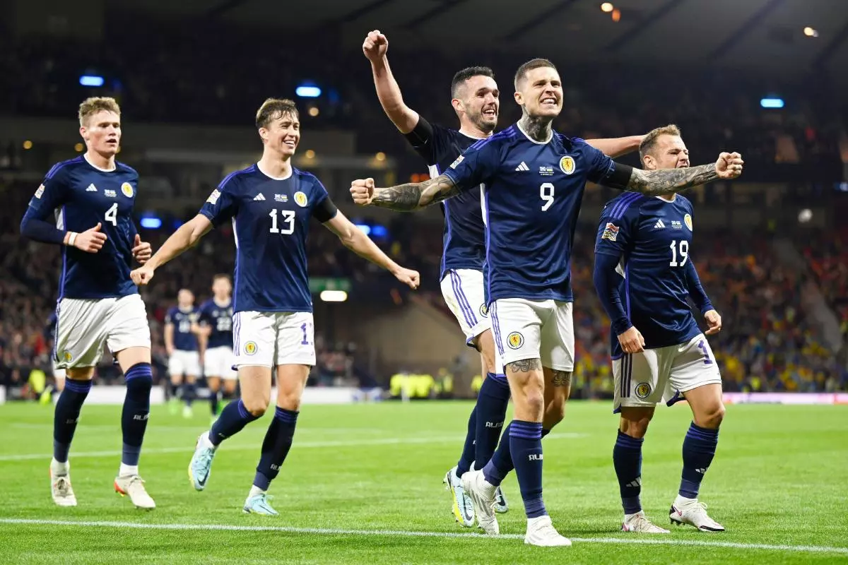 Lyndon Dykes of Scotland celebrates after scoring