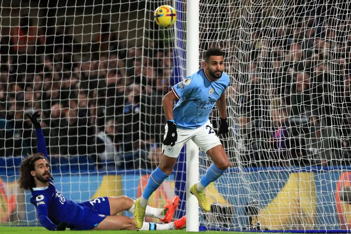 Manchester City's Riyad Mahrez scores against Chelsea