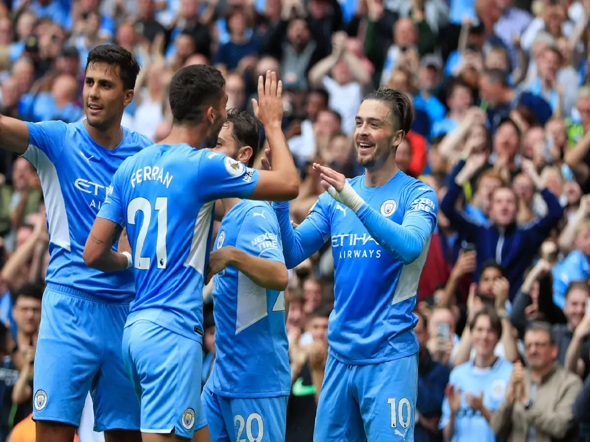 Manchester City celebrate scoring against Norwich City in the Premier League