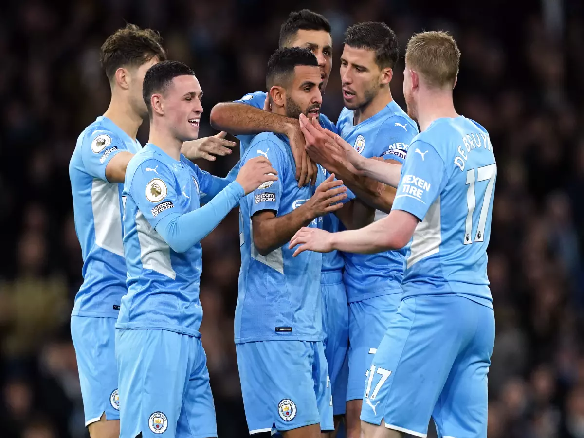 Manchester City's Riyad Mahrez (centre) celebrates scoring their side's fourth goal of the game during the Premier League match at the Eithad Stadium, Manchester. Picture date: Tuesday Decemb