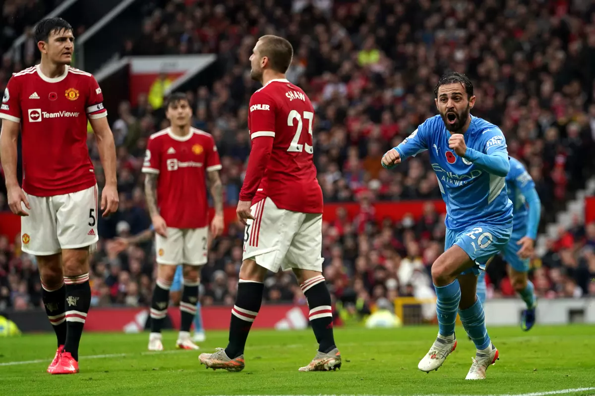 Manchester City's Bernardo Silva celebrates scoring the second goal of the game past Manchester United goalkeeper David de Gea during the Premier League match at Old Trafford, Manchester.