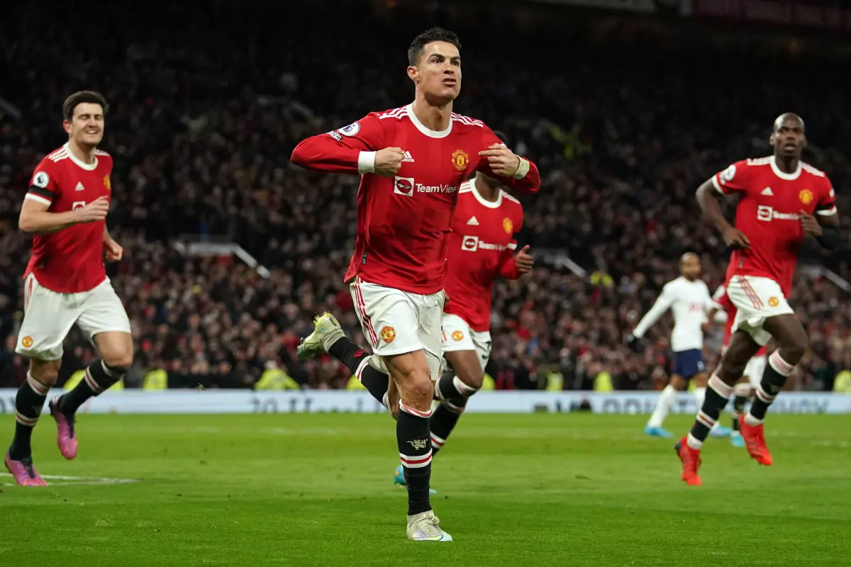 Manchester United's Cristiano Ronaldo (centre) celebrates scoring his hat trick goal and his sides third goal of the game during the Premier League match at Old Trafford, Manchester.