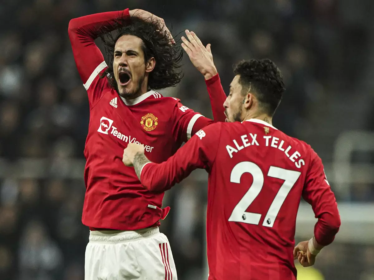 Manchester United's Edinson Cavani (left) celebrates scoring their side's first goal of the game during the Premier League match at St. James' Park, Newcastle. Picture date: Monday December 2