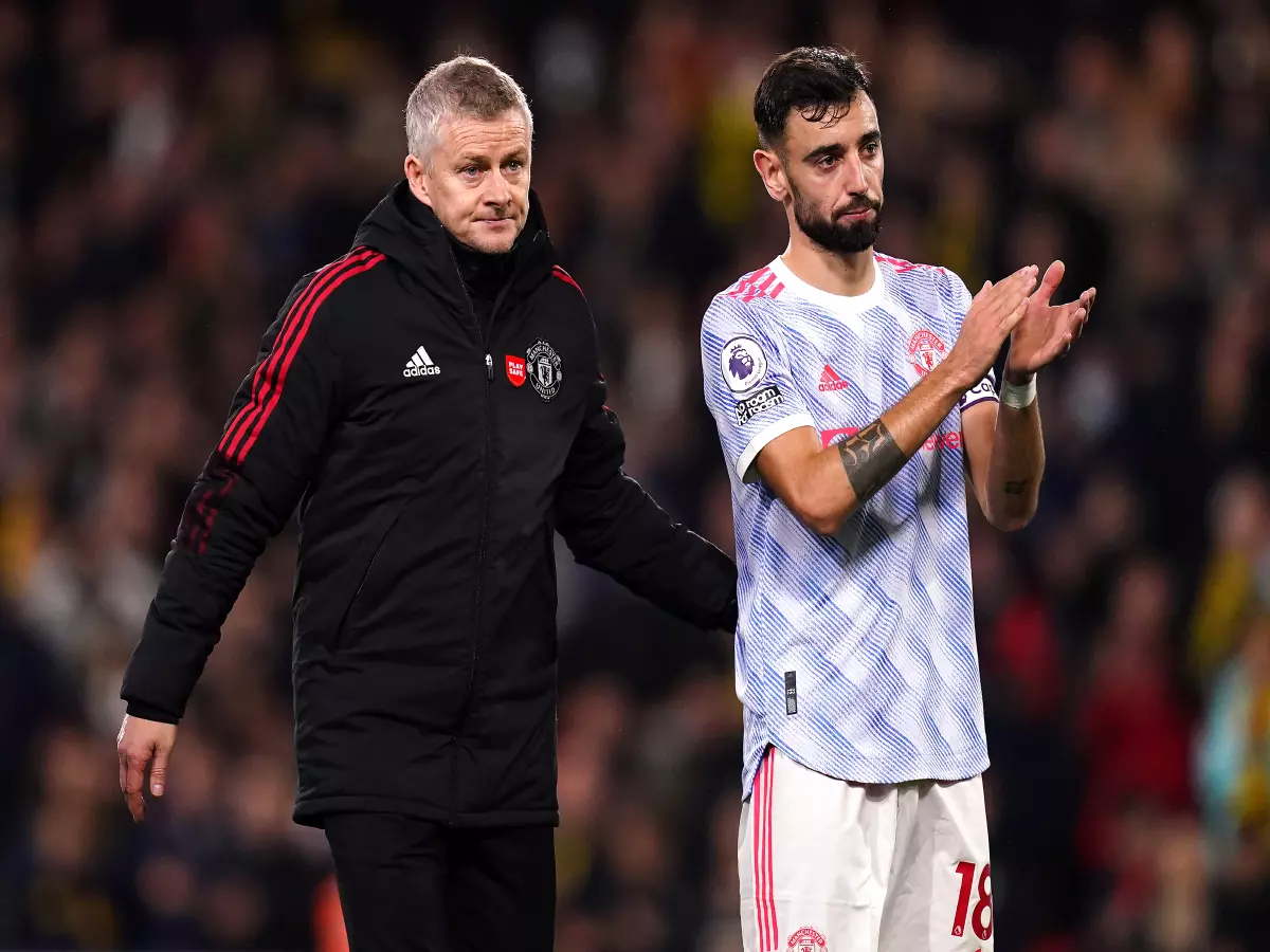 Manchester United manager Ole Gunnar Solskjaer (left) and Bruno Fernandes applaud the fans after the final whistle during the Premier League match at Vicarage Road, Watford.