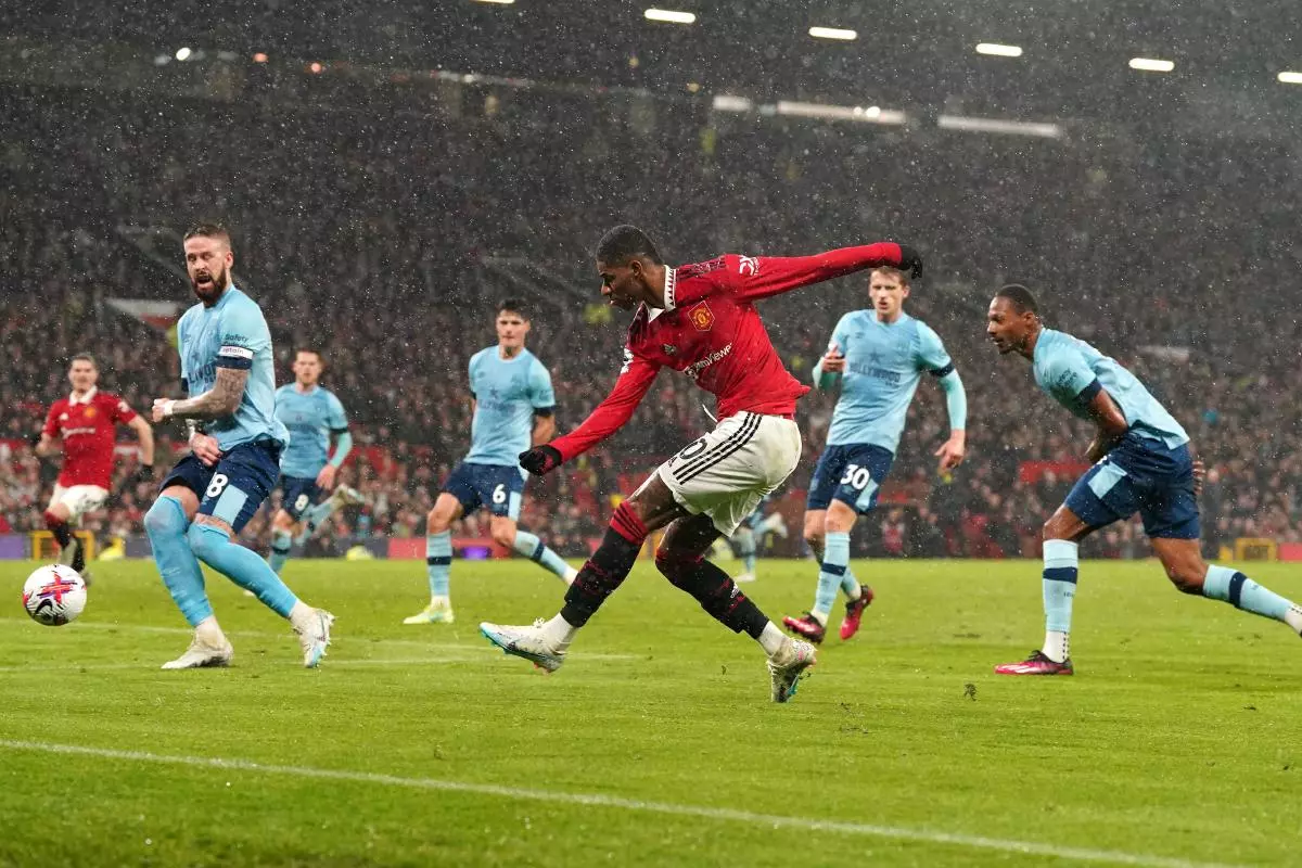 Manchester United's Marcus Rashford shoots towards goal during the Premier League match at Old Trafford - April 2023