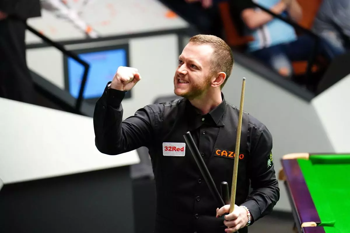 Mark Allen celebrates after beating Jak Jones on day twelve of the Cazoo World Snooker Championship at the Crucible Theatre - April 2023