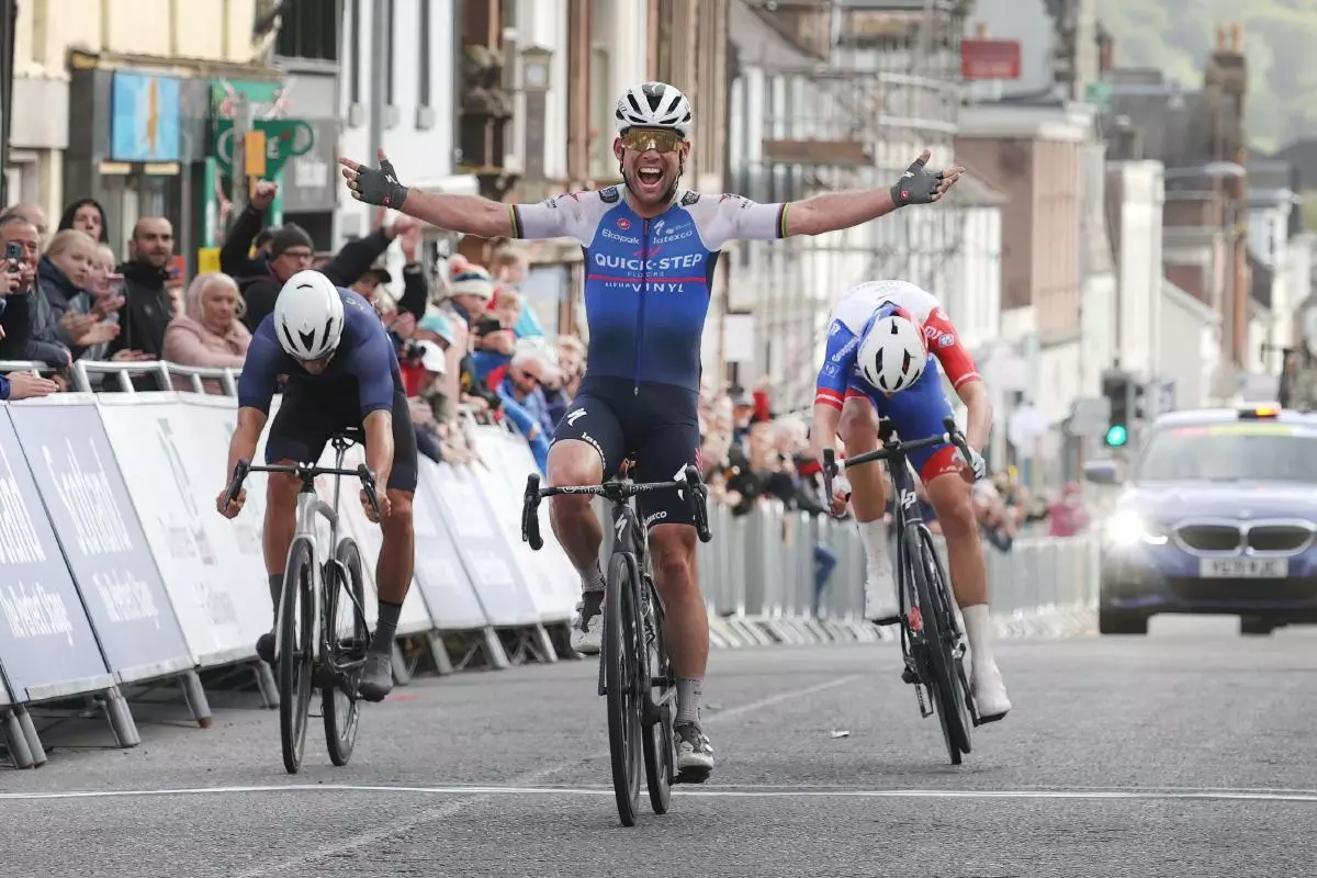 Mark Cavendish celebrates after winning the Men's Elite race in Castle Douglas during the 2022 British National Road Championships road race