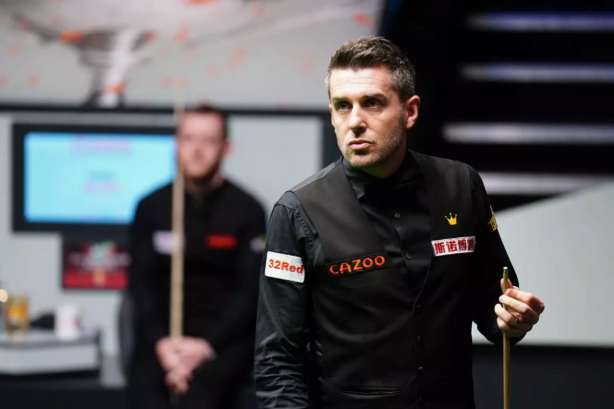 Mark Selby in action against Mark Allen (left) on day fifteen of the Cazoo World Snooker Championship - April 2023