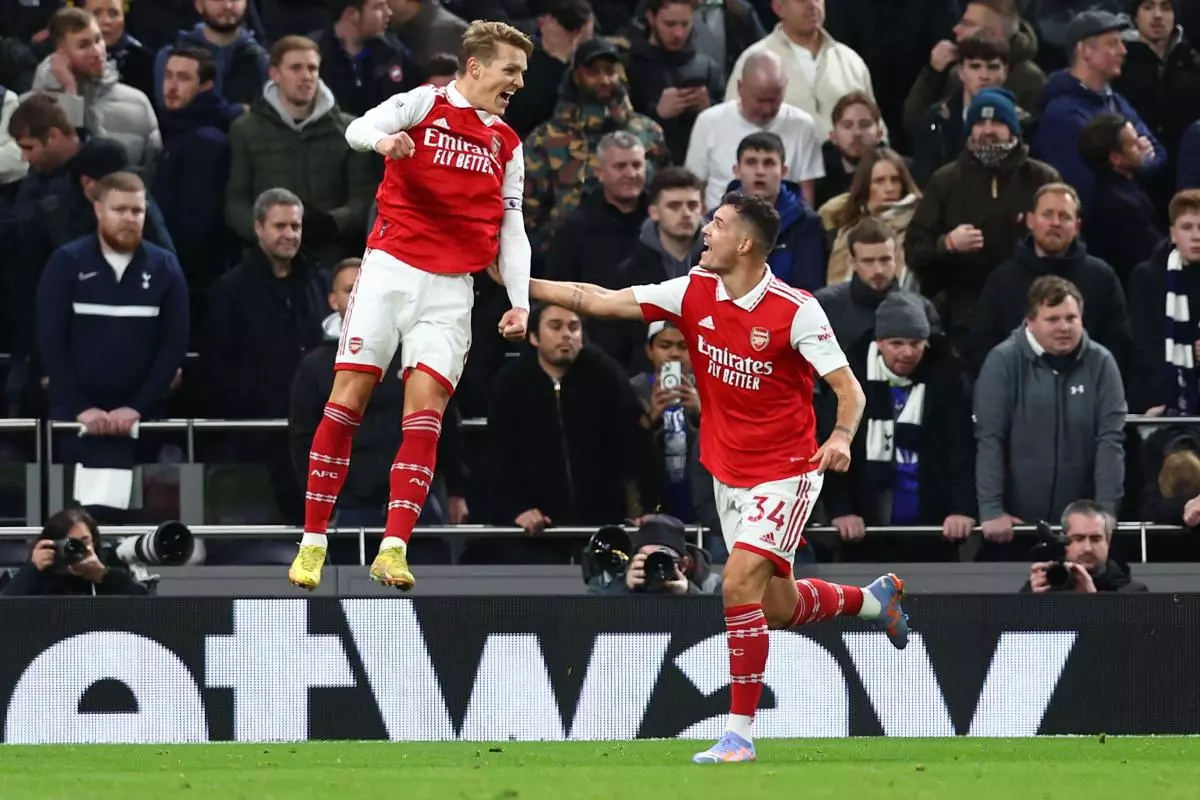 Martin Odegaard of Arsenal (l) celebrates scoring their second goal v Spurs