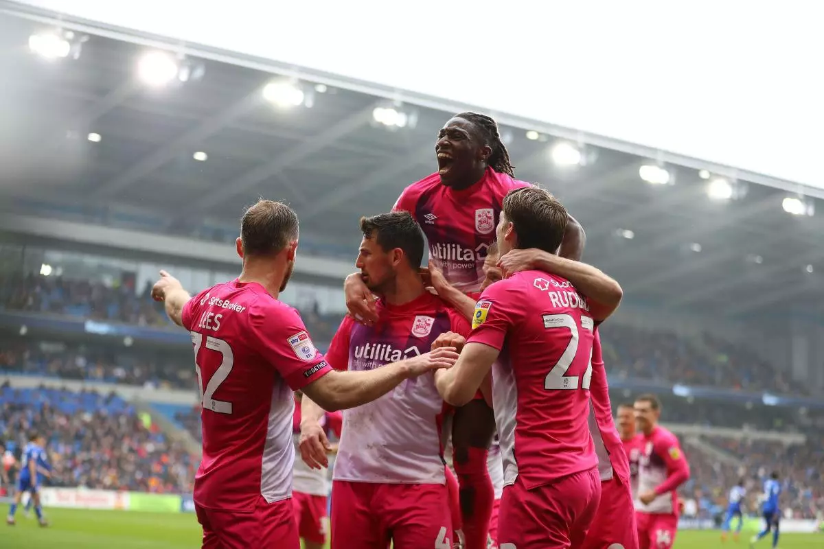 Matty Pearson of Huddersfield Town celebrates with his teammates after scoring against Cardiff - April 2023