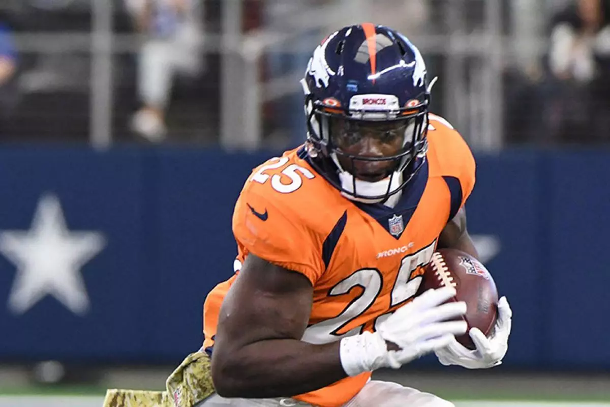 Melvin Gordon runs against the Dallas Cowboys