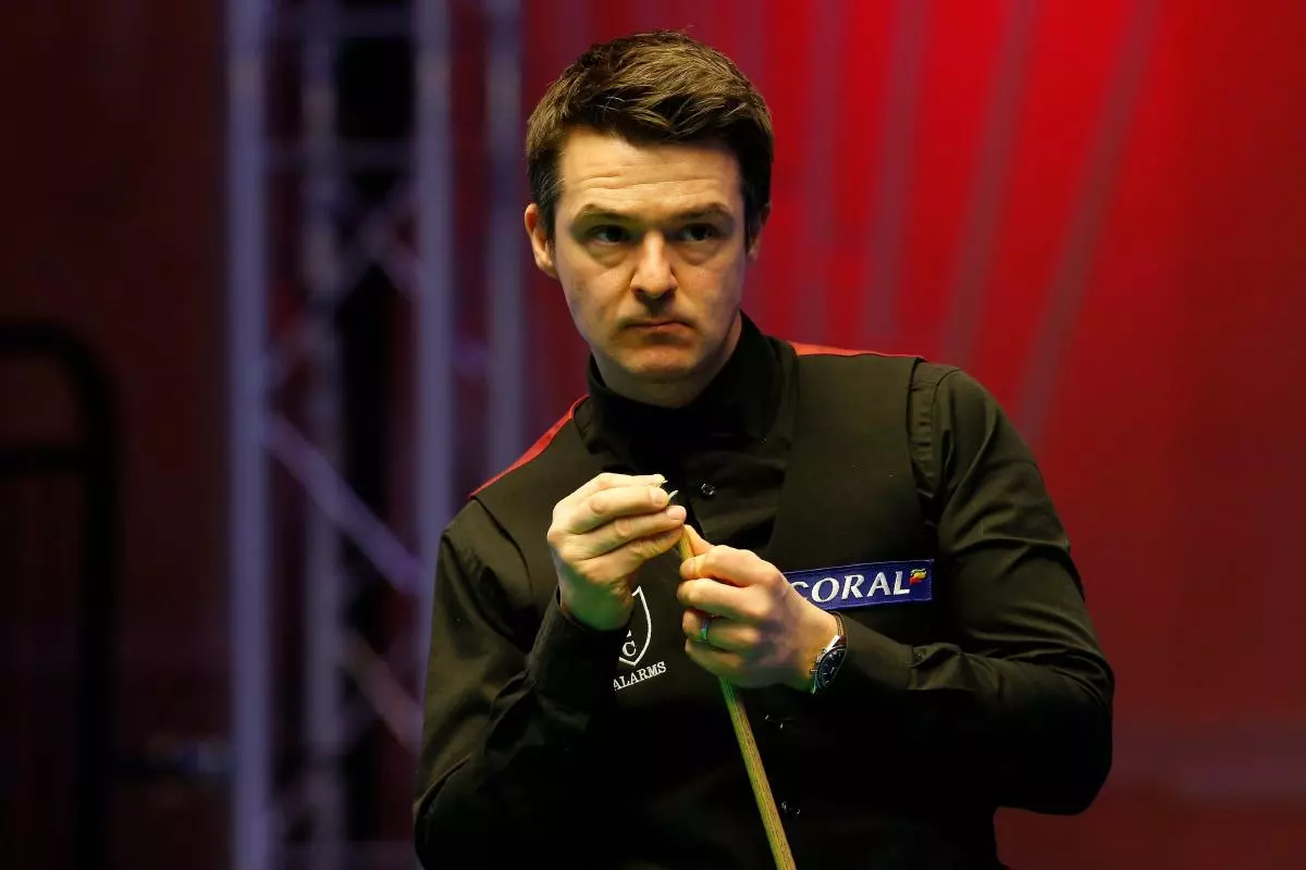 Michael Holt (ENG) looks at the scoreboard during his first round match