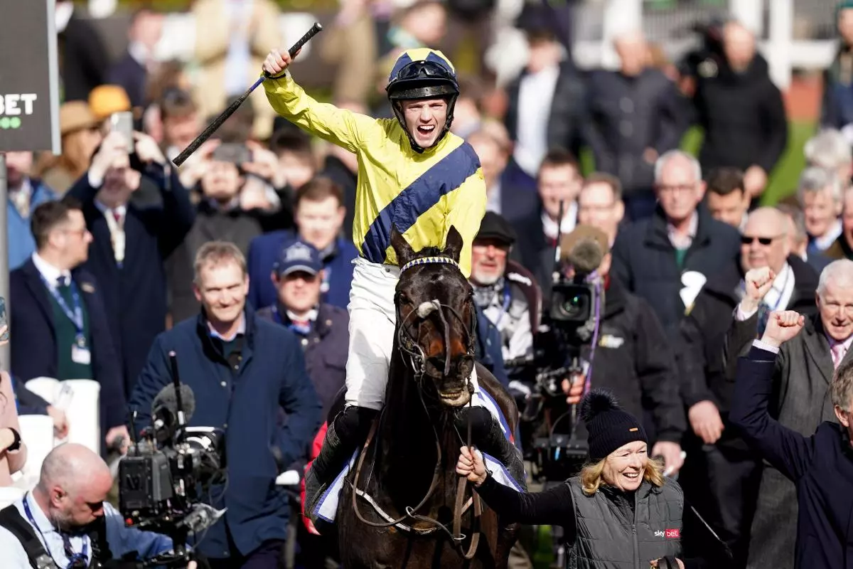 Michael O'Sullivan celebrates winning the Sky Bet Supreme Novices' Hurdle with Marine Nationale