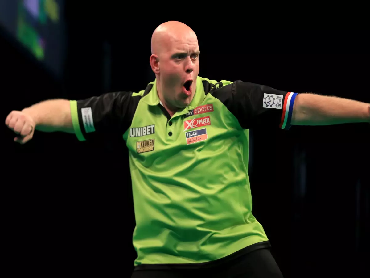 Michael Van Gerwen celebrates victory in the Premier League Play-Offs Final against Rob Cross during the Premier League Play-Offs at The O2, London.