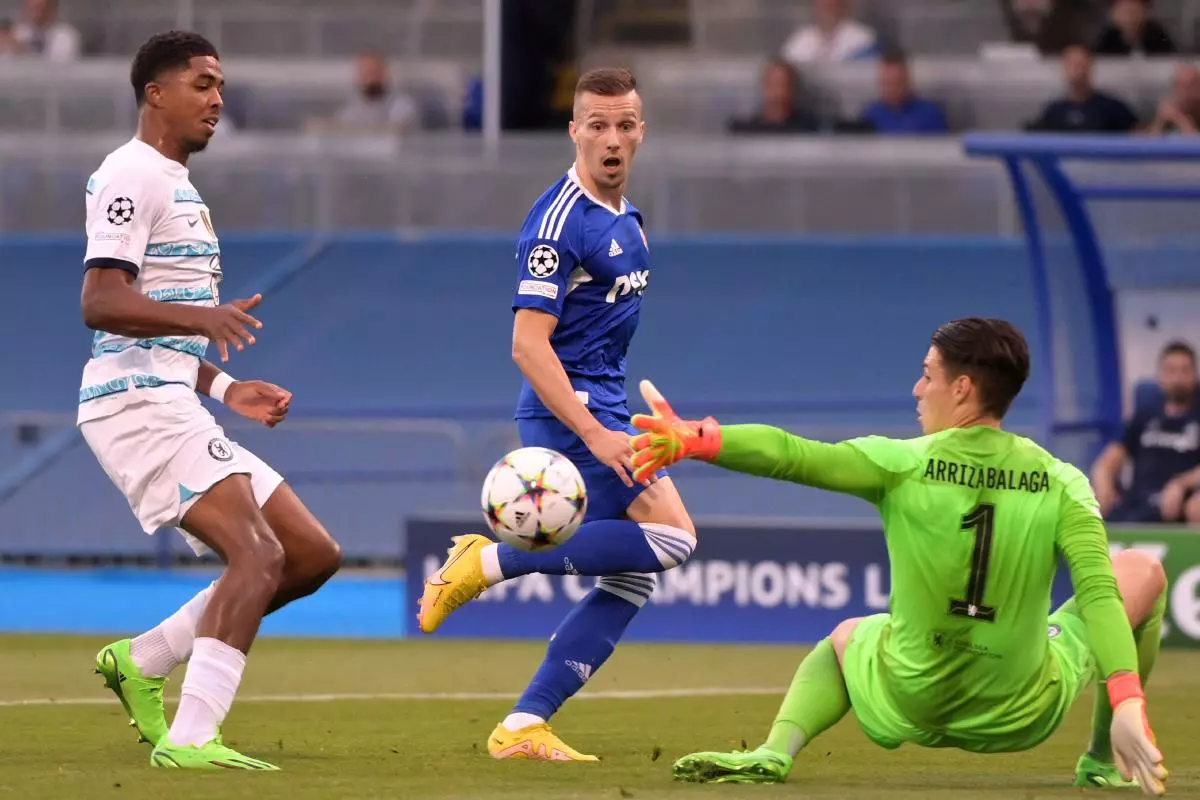 Mislav Orsic scores for Dinamo Zagreb against Chelsea as Wesley Fofana looks on