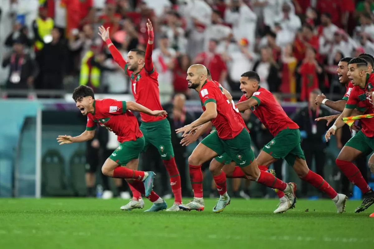 Morocco players celebrating victory over Spain