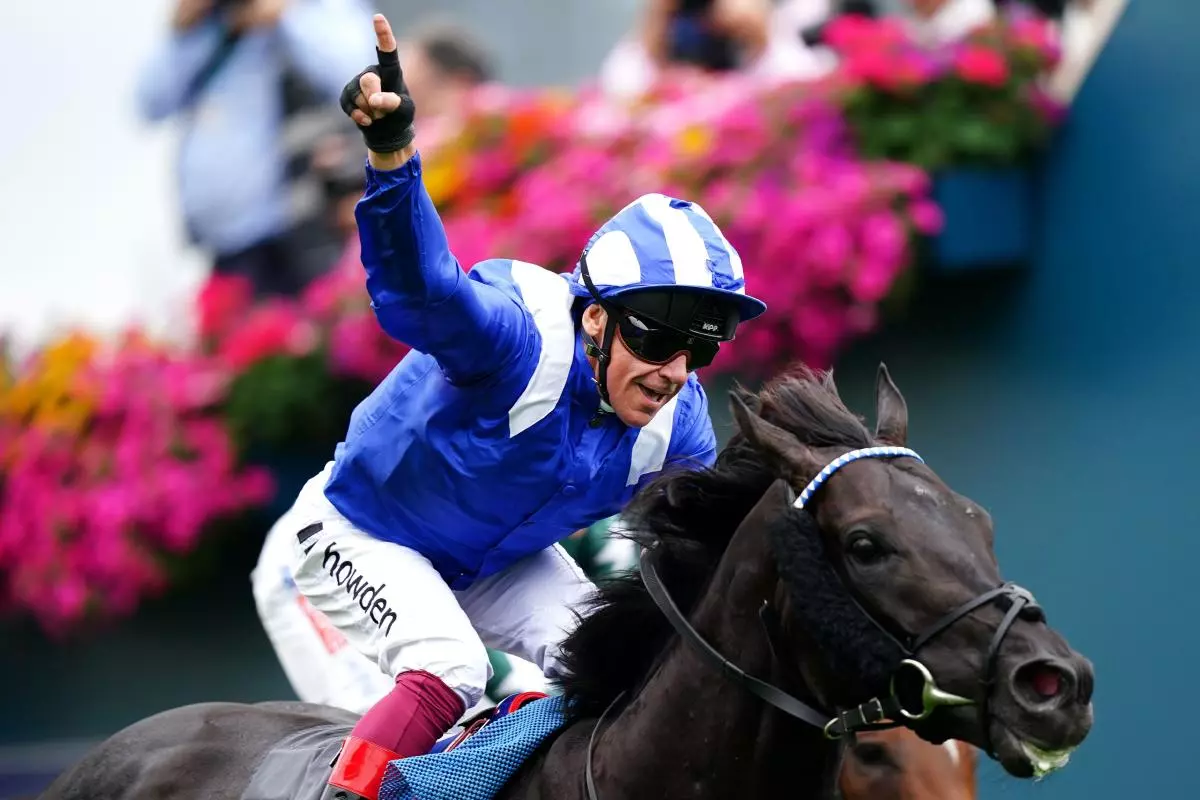 Mostahdaf ridden by jockey Frankie Dettori wins the Juddmonte International Stakes at York