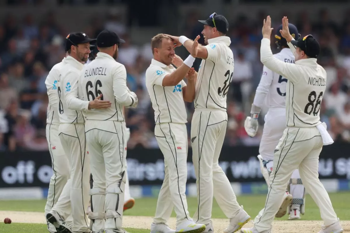 New Zealand's Neil Wagner celebrates with teammates after taking the wicket of England's Ben Foakes June 2022