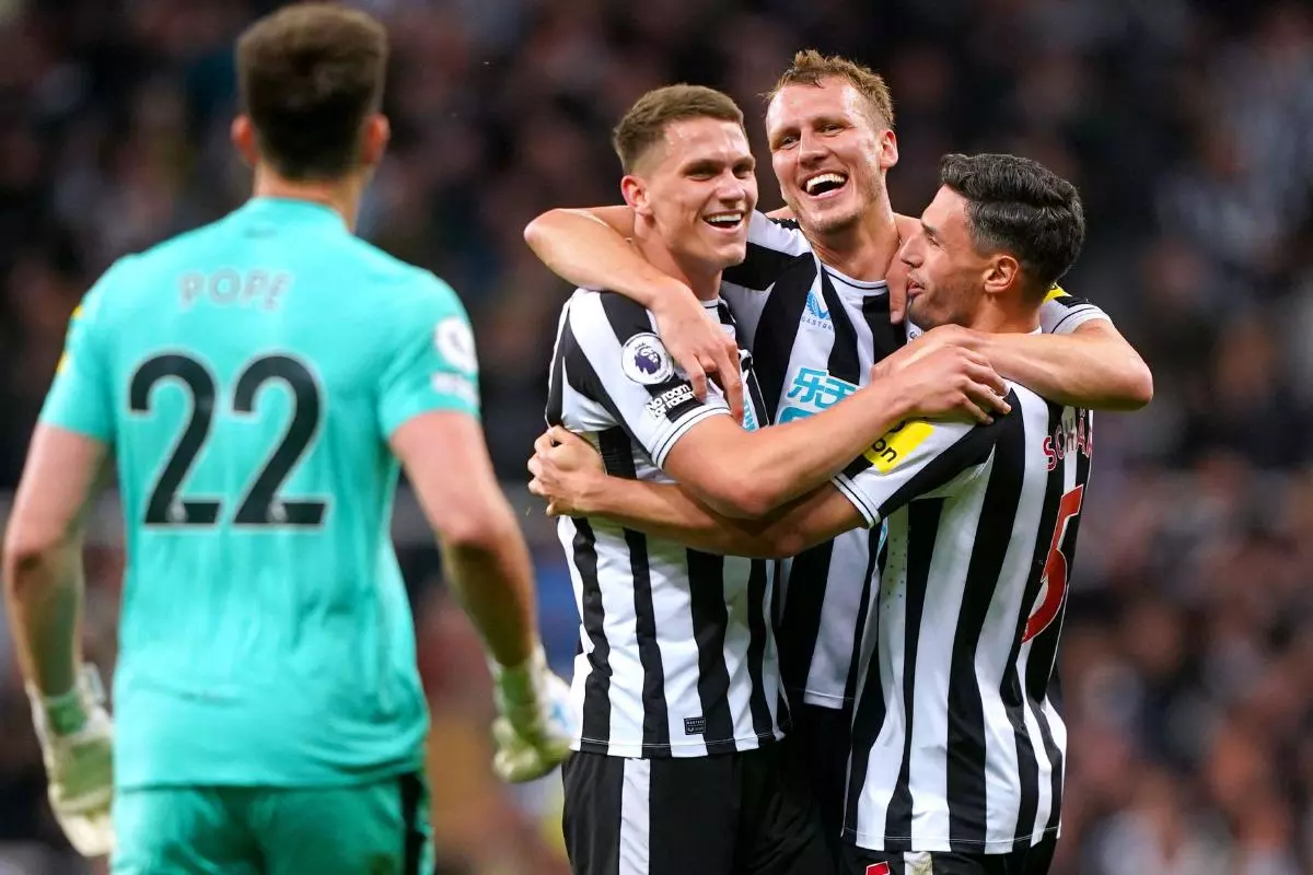 Newcastle United's Sven Botman, Dan Burn and Fabian Schar celebrate